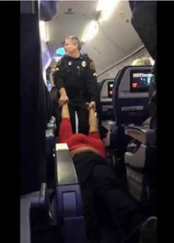 Police Officers Caught Dragging a Woman Out of Plane After Knocking Her Unconscious (Photo+Video)